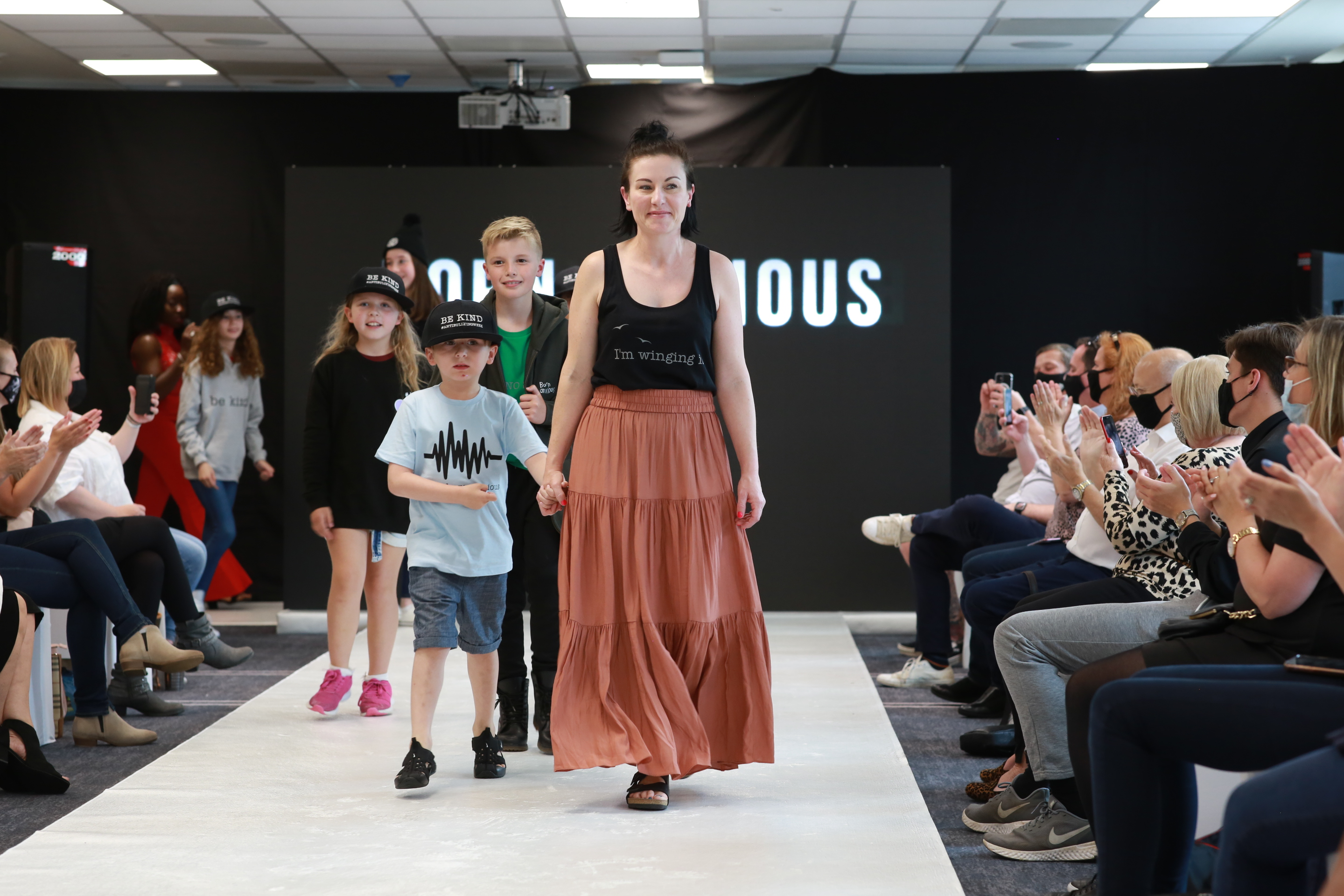 Founder Kellie with son Oscar on the catwalk 